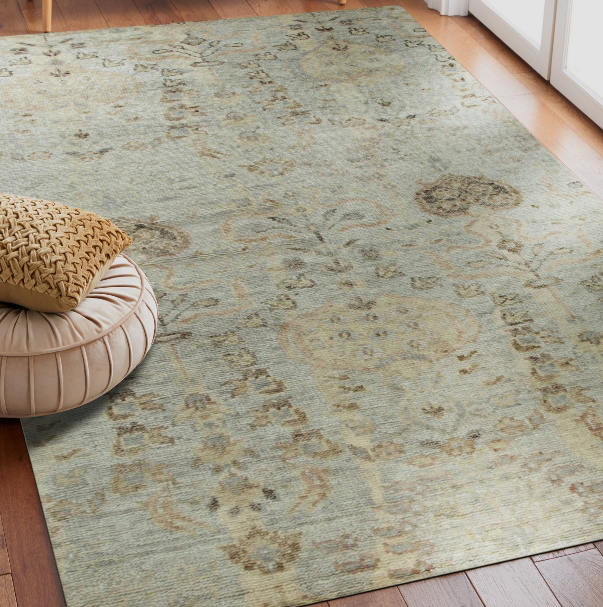 Nina Luxurious Ivory Hand Knotted Wool Rug, its plush ivory pile richly textured and subtly patterned, lays elegantly in a bright, modern living space.