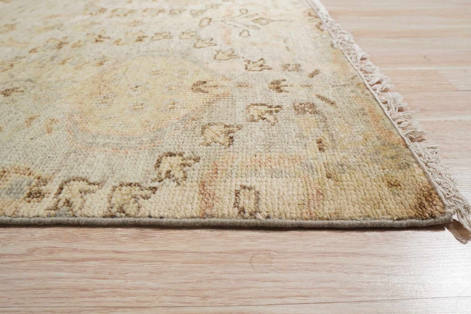 Nina Luxurious Ivory Hand Knotted Wool Rug, an inviting ivory wool rug with subtle texture, adding warmth and luxury to a living space.