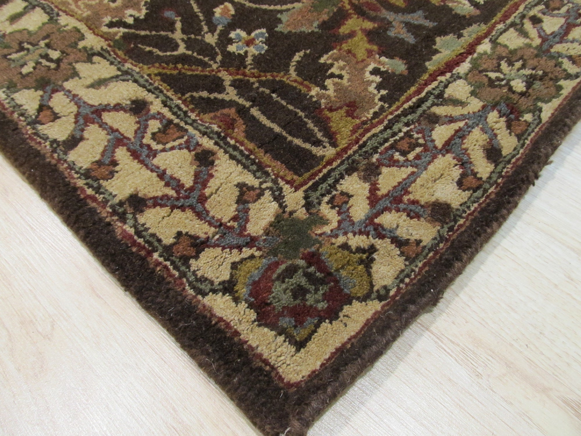 Here's the alt text based on the provided information:
 
 Luna Delicate Brown Hand Tufted Wool Rug, soft brown tones blending in a modern living space. A hand-tufted wool rug anchoring a seating area with light-toned furniture and natural light.