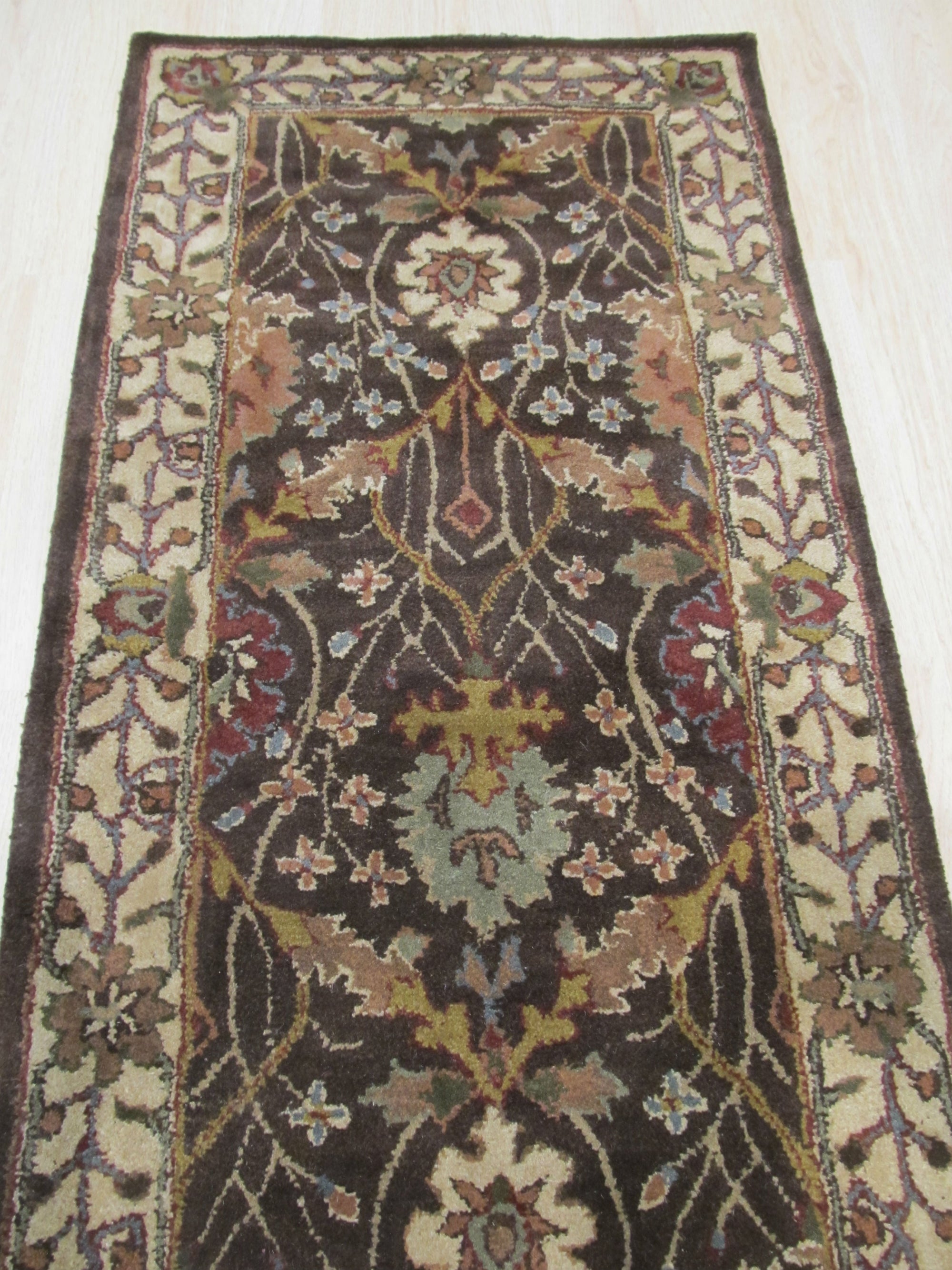 Luna Delicate Brown Hand Tufted Wool Rug, warm brown hues and plush texture define this hand-tufted wool rug, creating a welcoming atmosphere in a softly lit room.