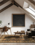 Luna Delicate Brown Hand Tufted Wool Rug, a warm brown and cream-toned wool rug with subtle texture, grounding a modern living room with layered textiles and soft lighting.