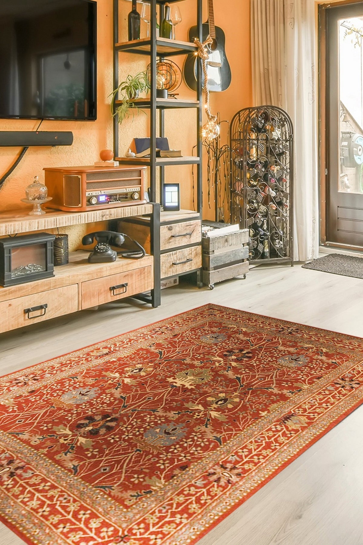 Lydia Vibrant Red Hand Tufted Wool Rug, a fiery red wool rug with a geometric pattern, anchoring a contemporary living room with a gray sofa and warm wood accents.