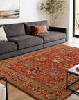 Lydia Vibrant Red Hand Tufted Wool Rug styled in a modern living room with charcoal sofa - area rug lifestyle photo