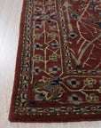 Lydia Vibrant Red Hand Tufted Wool Rug, a vibrant red wool rug with a textured, possibly abstract, design, placed in a bright, modern living space with light wood floors and neutral furniture.