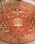 Lydia Vibrant Red Hand Tufted Wool Rug, its swirling patterns and dense wool pile adding warmth and a splash of rich red to a light-filled living space.