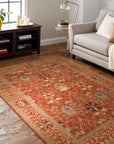 Lydia Vibrant Red Hand Tufted Wool Rug displayed on a light wood floor. Rich crimson hues and plush wool texture radiate warmth and sophistication in this detail shot. Hand-tufted construction promises luxurious comfort.