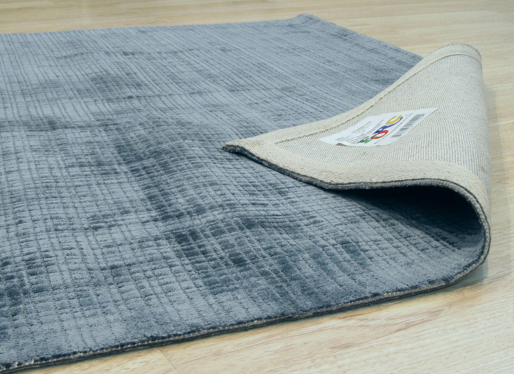 Captivating Lush Blue Handmade Rug, deep indigo and cerulean hues blend in a textured weave, hints of darker blues create visual depth, showcasing its plush pile.