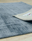 Captivating Lush Blue Handmade Rug, deep indigo and cerulean hues blend in a textured weave, hints of darker blues create visual depth, showcasing its plush pile.
