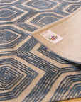 Maya Sophisticated Ivory Hand Tufted Wool & Viscose Rug, its subtle ivory hues and intricate hand-tufted texture lending an air of understated elegance to a modern living space.
