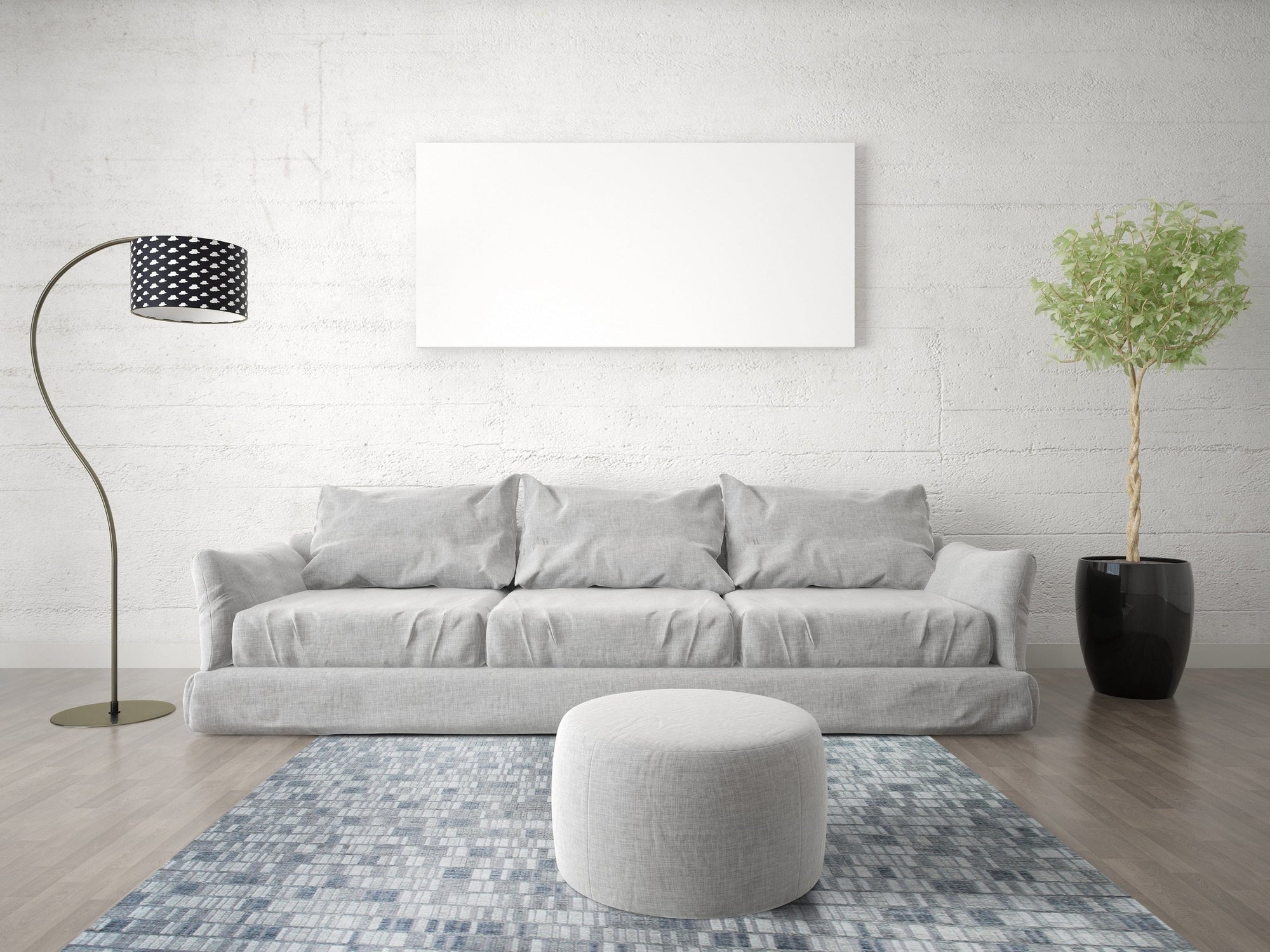 Tessa Sophisticated Gray Hand Knotted Wool Rug gracing a bright, modern living room. Neutral furniture complements the rug's subtle gray tones and hand-knotted texture, creating a calming and elegant space.