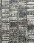 Tessa Sophisticated Gray Hand Knotted Wool Rug, its soft gray hues and hand-knotted texture grounding a modern living space.