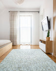 Freya Timeless Ivory Hand Knotted Wool Rug, soft ivory tones and intricate hand-knotted details seen in a warmly lit living space.