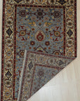 Vibrant Oriental Blue Hand Knotted Wool Rug, showcasing a rich blue field and intricate floral patterns, displayed in a bright, modern living room.