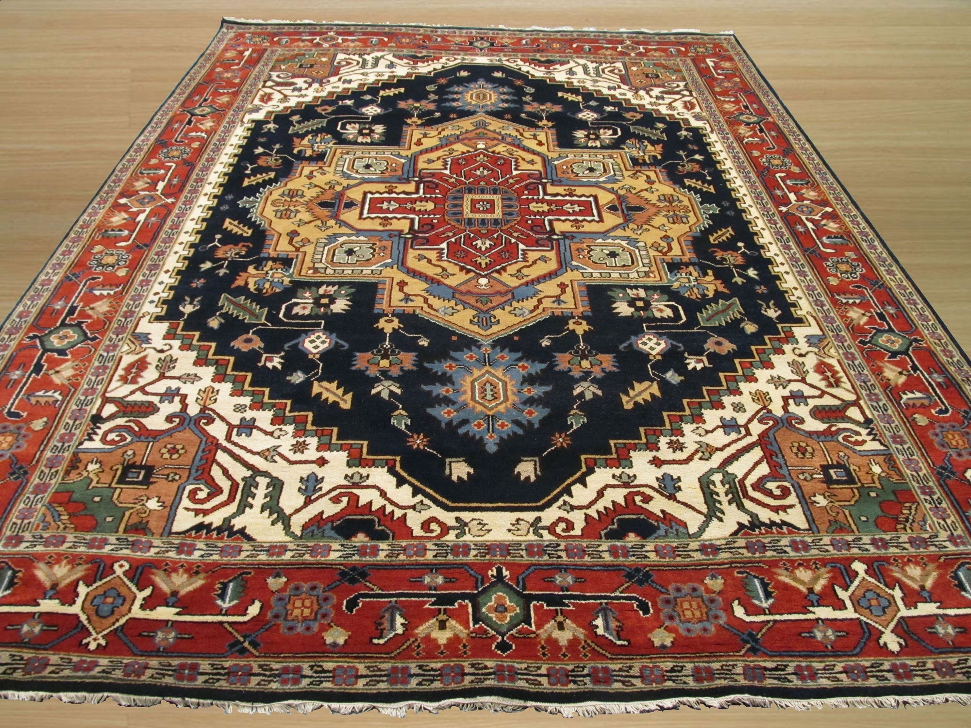 Ella Oriental Navy Hand Knotted Wool Rug, its rich navy hues and intricate oriental pattern displayed as a luxurious floor covering in a styled interior setting.