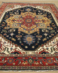 Ella Oriental Navy Hand Knotted Wool Rug, its rich navy hues and intricate oriental pattern displayed as a luxurious floor covering in a styled interior setting.