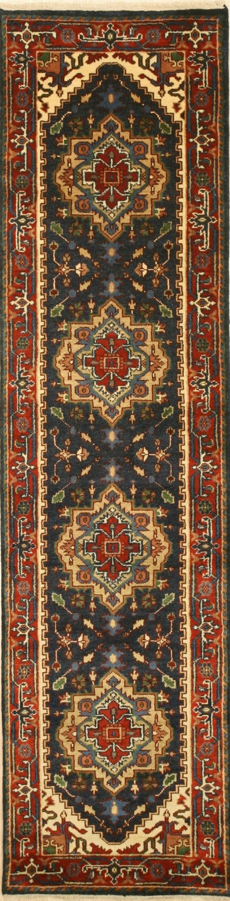 Ella Oriental Navy Hand Knotted Wool Rug, a deep navy wool rug with an intricate, traditional oriental pattern, laid on a light wood floor showcasing its texture and design details.