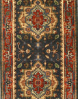 Ella Oriental Navy Hand Knotted Wool Rug, a deep navy wool rug with an intricate, traditional oriental pattern, laid on a light wood floor showcasing its texture and design details.