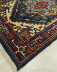 Ella Oriental Navy Hand Knotted Wool Rug, a navy wool rug with an intricate oriental design, displayed in a bright, modern living room.