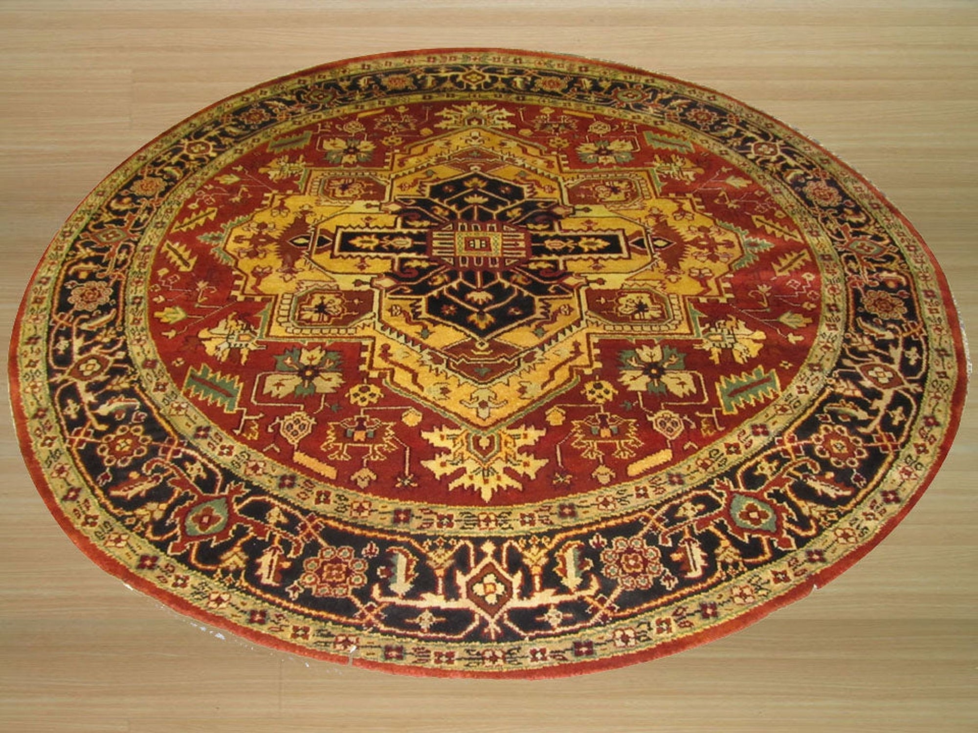 Harlow Oriental Rust Hand Knotted Wool Rug, displaying intricate floral patterns in warm rust and earthy tones, lying flat on a light surface to highlight its detailed construction.