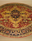 Harlow Oriental Rust Hand Knotted Wool Rug, displaying intricate floral patterns in warm rust and earthy tones, lying flat on a light surface to highlight its detailed construction.