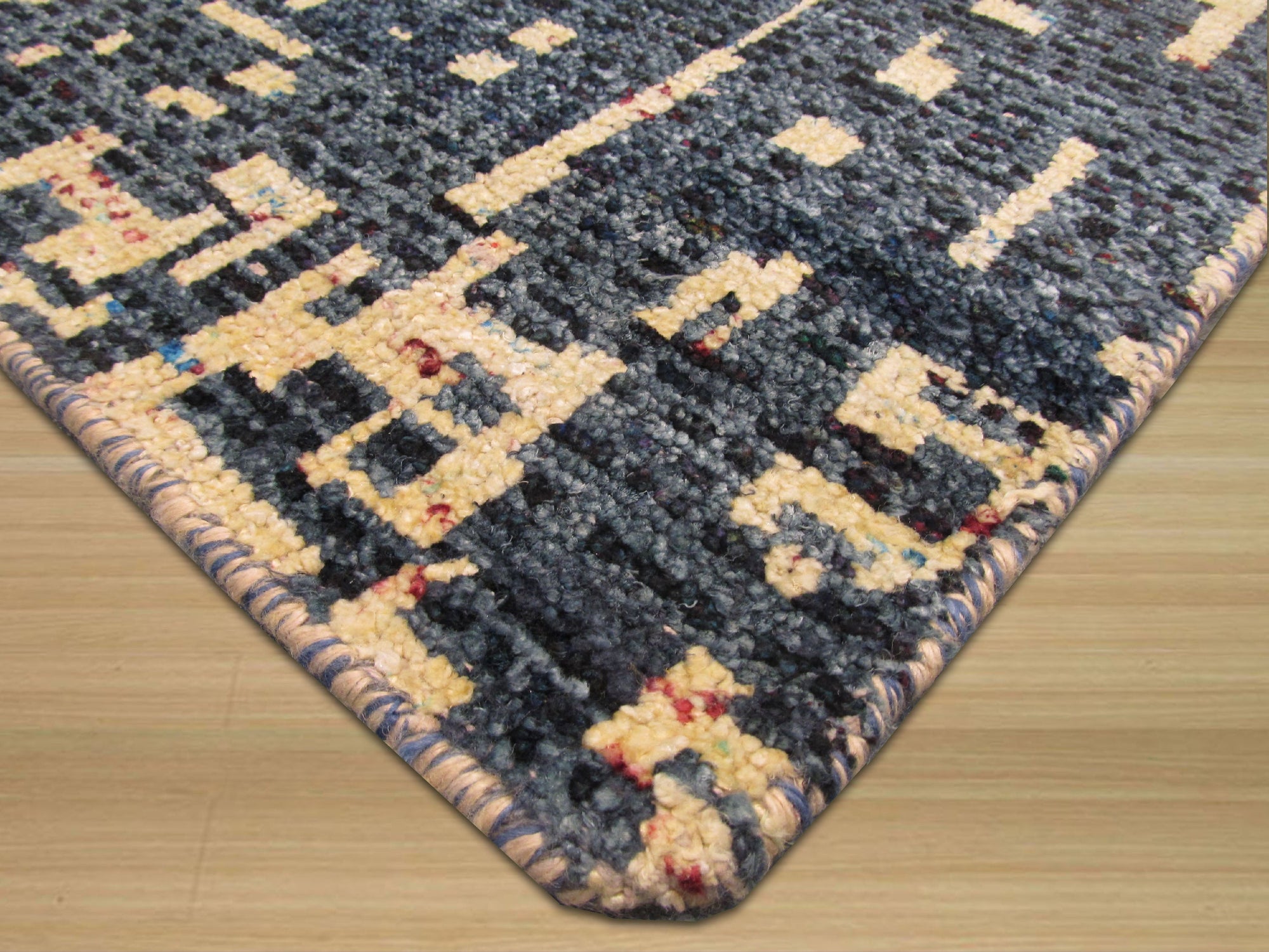 Elena Stylish Blue Hand Knotted Sari-Silk Rug, showcasing a richly textured blue surface with subtle variations in tone and sheen, its hand-knotted construction evident in the intricate details and luxurious drape.