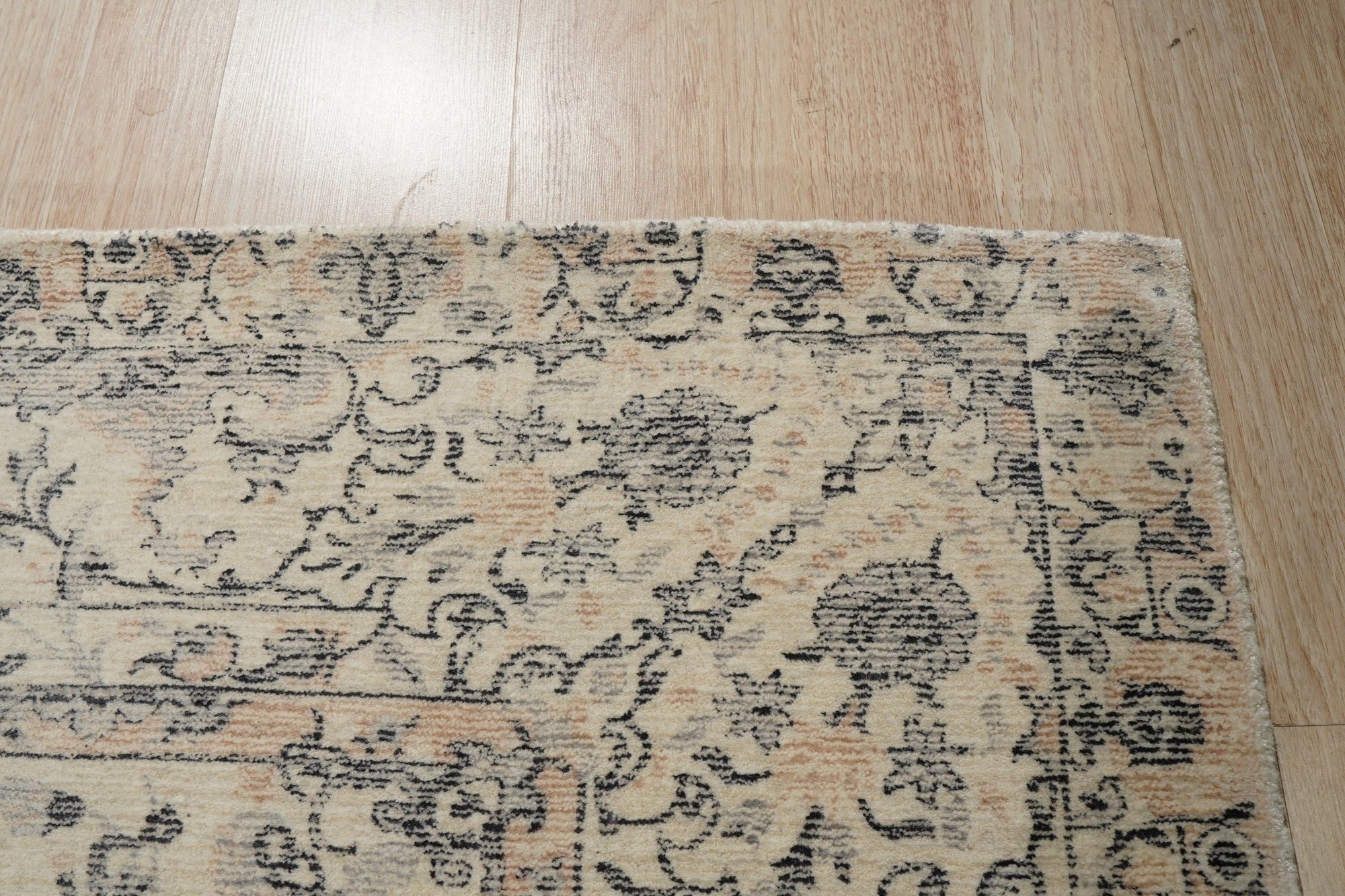 Sleek Rustic Beige Handmade Wool Rug, showcasing its textured beige wool construction and subtle, rustic design elements in a bright, naturally lit room setting.