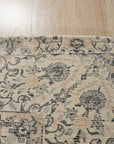 Sleek Rustic Beige Handmade Wool Rug, showcasing its textured beige wool construction and subtle, rustic design elements in a bright, naturally lit room setting.