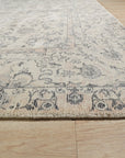 Sleek Rustic Beige Handmade Wool Rug layered atop a hardwood floor, its neutral tones and subtle texture creating a warm and inviting atmosphere.