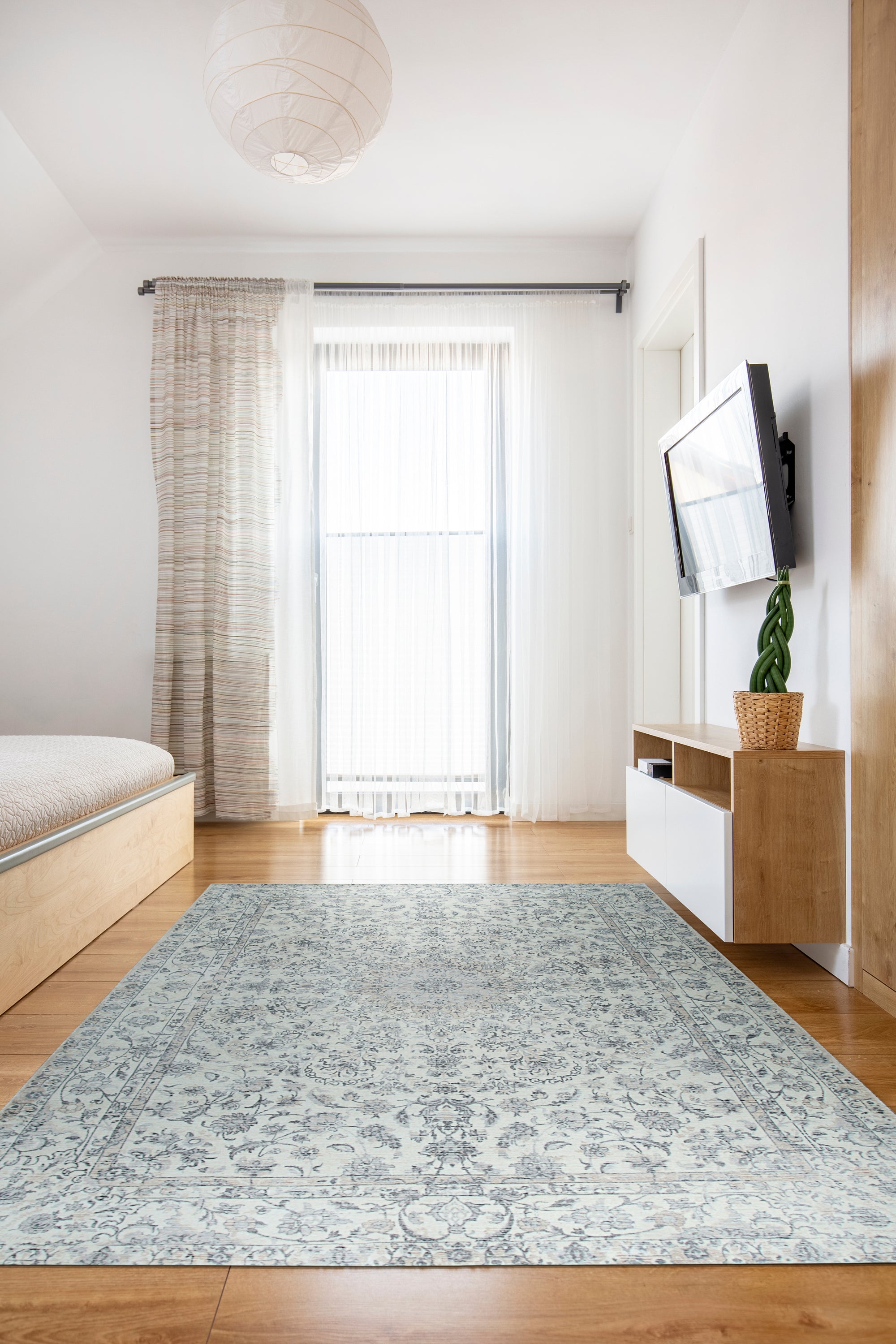 Sleek Rustic Beige Handmade Wool Rug, seen in a well-lit interior, displaying its textured wool construction and subtle beige tones, adding warmth to the room.