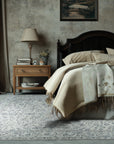 Sleek Rustic Beige Handmade Wool Rug, its neutral tones and subtle texture complement a modern living space with hardwood floors and natural light, adding warmth and understated elegance.