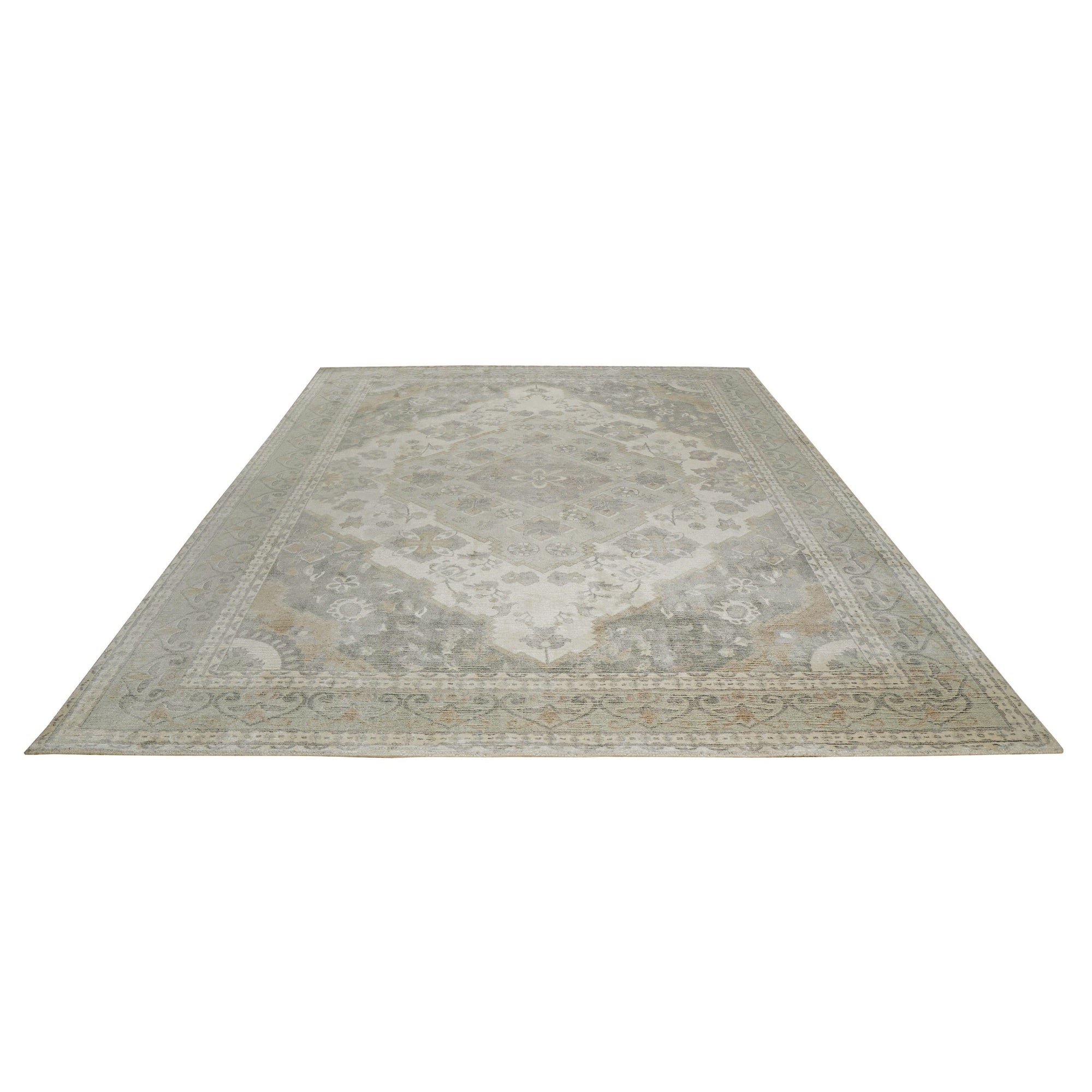 Selene Oriental Green Handmade Wool Rug, showcasing a detailed traditional pattern in shades of green, ivory, and hints of other muted colors. The handmade wool construction highlights the rug's intricate design and texture.