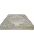 Selene Oriental Green Handmade Wool Rug, showcasing a detailed traditional pattern in shades of green, ivory, and hints of other muted colors. The handmade wool construction highlights the rug's intricate design and texture.