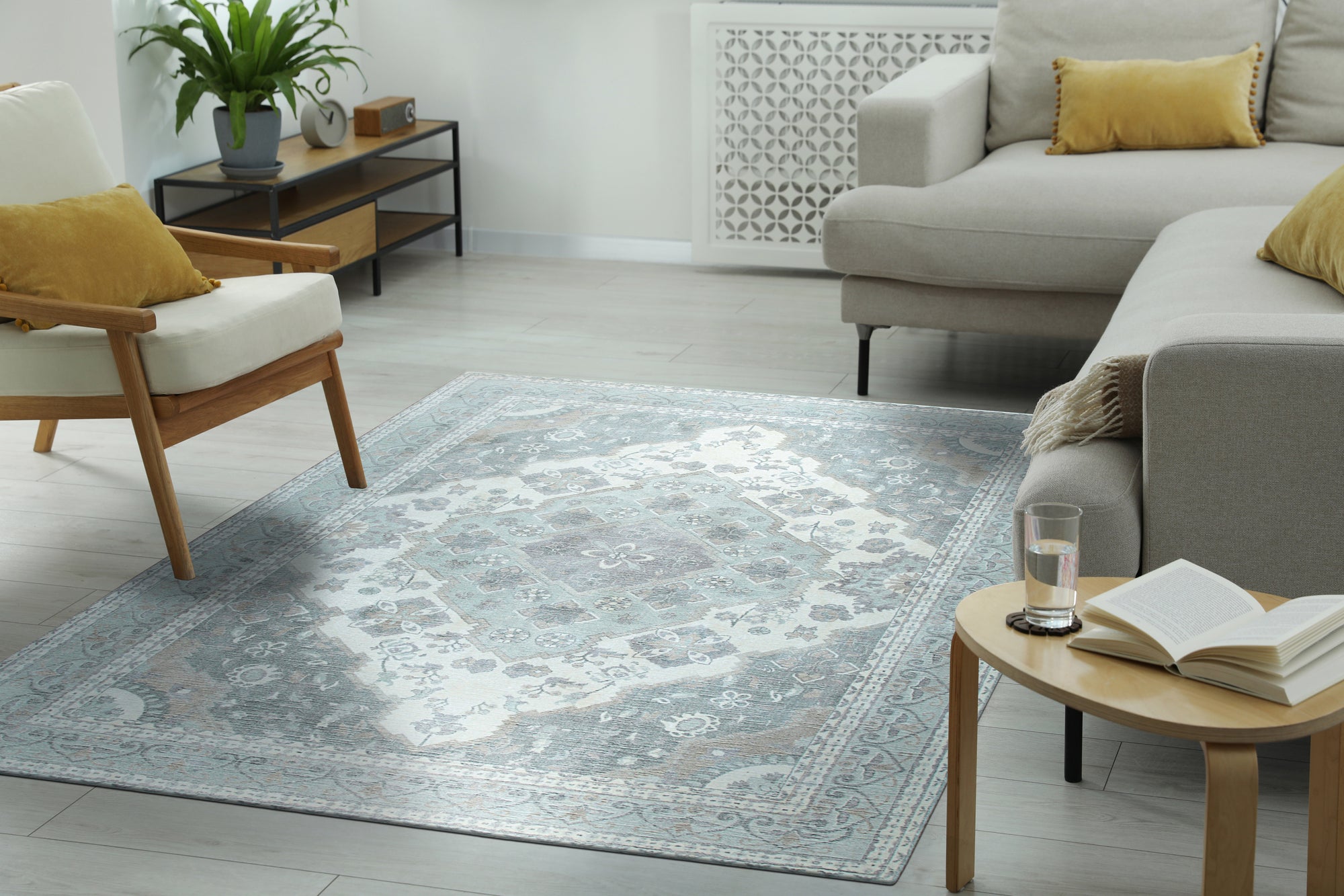 Selene Oriental Green Handmade Wool Rug displayed in a room setting, showcasing its vibrant green hues and intricate oriental pattern. Wool construction and handmade detail visible.
