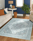 Selene Oriental Green Handmade Wool Rug, showcasing intricate floral patterns and borders in shades of green, cream, and gold, seen in a brightly lit room demonstrating its size and placement.