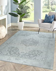 Silver Oasis Rug shown in a styled living room setting