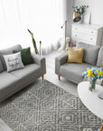 Luxurious Kilim Charcoal Handmade Wool Rug, showcasing its geometric patterns and rich charcoal hues on a living room floor, blending seamlessly with modern furniture.