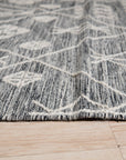 Luxurious Kilim Charcoal Handmade Wool Rug, textural wool weaves create depth and shadow in this charcoal grey rug, its kilim design adding artisanal warmth to a modern living space.