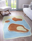 Yara Rustic Blue Hand Tufted Wool Rug, its cool blues and earthy tones grounding a contemporary living room with natural light and minimalist furniture.