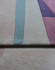 Iris Exquisite Multicolor Hand Tufted Wool Rug, bursts with vibrant hues across a textured surface, its intricate pattern adding warmth and artistry to the room.