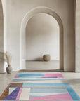 Iris Exquisite Multicolor Hand Tufted Wool Rug, a vibrant explosion of color in a modern living room, its plush wool pile adding warmth and texture to the space.