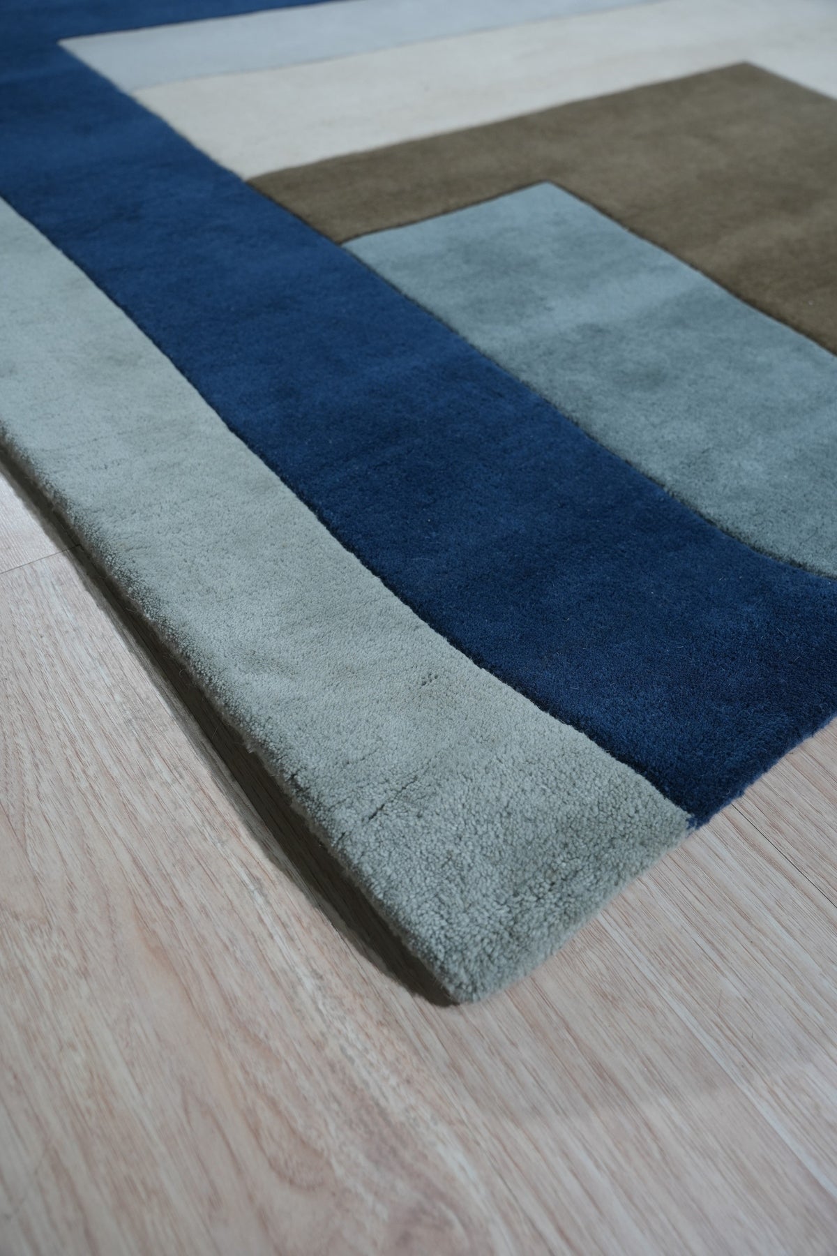 Bespoke Iris Multicolor Hand Tufted Wool Rug, showcasing a vibrant explosion of floral hues across a luxurious hand-tufted wool surface, creating a warm and inviting atmosphere in a modern living space.