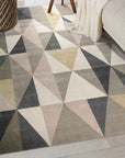 Trendy Classic Multicolor Hand Tufted Wool Rug, showcasing vibrant hues woven in a dense hand-tufted construction, displayed on a light hardwood floor with natural light accentuating its texture and color variations.