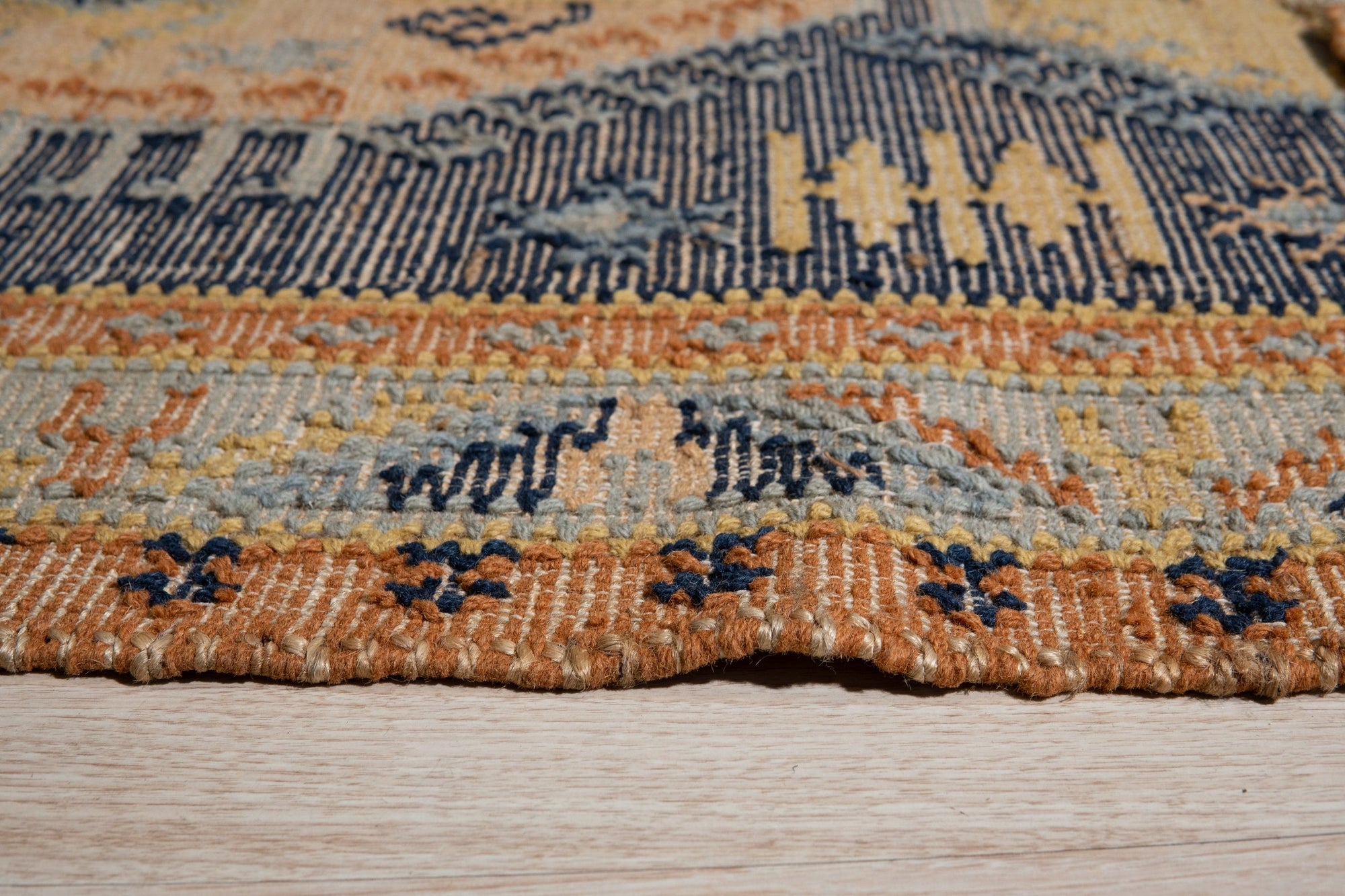 Luna Kilim Blue Hand Knotted Wool Rug, a hand-knotted wool rug in shades of blue, seen showcasing its detailed Kilim design.