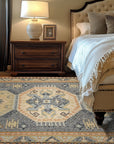 Luna Kilim Blue Hand Knotted Wool Rug displayed on a light wood floor. Indigo and cream geometric patterns define this hand-knotted wool rug, creating a cool and inviting atmosphere.