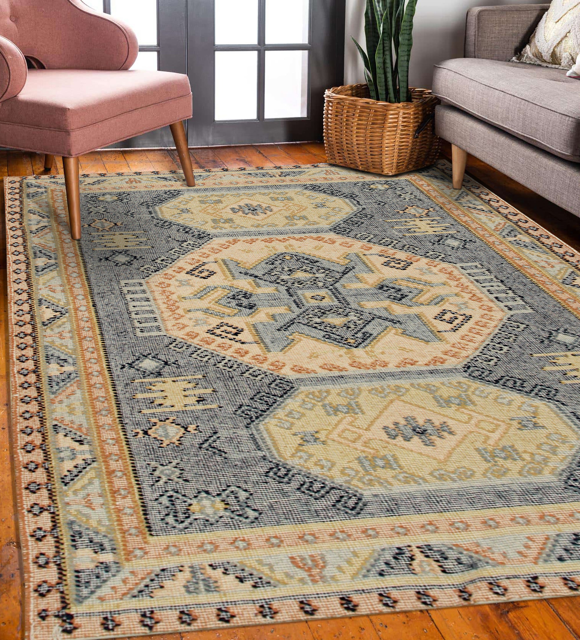 Luna Kilim Blue Hand Knotted Wool Rug, a vibrant blend of blues and creams in a geometric Kilim design, rests on a hardwood floor in a softly lit room.