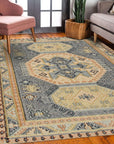 Luna Kilim Blue Hand Knotted Wool Rug, a vibrant blend of blues and creams in a geometric Kilim design, rests on a hardwood floor in a softly lit room.