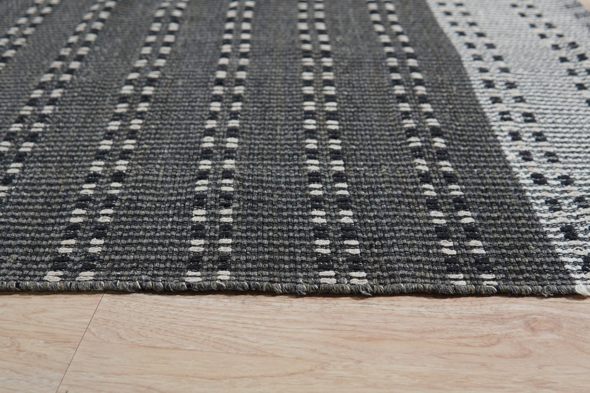 Clara Xena Charcoal Flatweave Wool & Cotton Rug, charcoal hues and flatweave texture blending seamlessly in a modern living space.