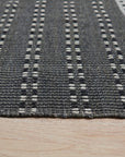 Clara Xena Charcoal Flatweave Wool & Cotton Rug, charcoal hues and flatweave texture blending seamlessly in a modern living space.