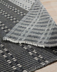 Clara Xena Charcoal Flatweave Wool & Cotton Rug, features a geometric design in varying shades of charcoal, flatwoven for a textural yet smooth feel.