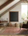 Celia Oushak Rust Hand Knotted Wool Rug, warm rust tones and intricate Oushak patterns define this hand-knotted wool rug, displayed within a warmly lit room setting.